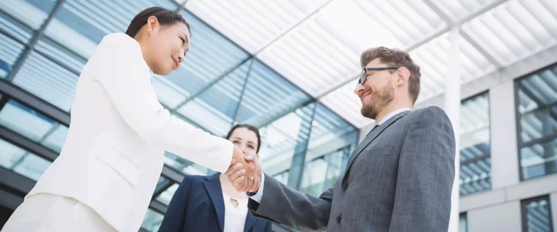 businessman-shaking-hands-with-colleague-ezgif.com-optiwebp